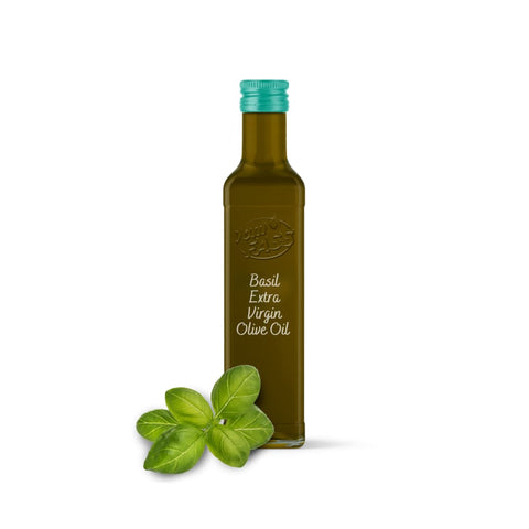 Basil extra virgin olive oil in a glass bottle with a teal cap, accompanied by fresh basil leaves.
