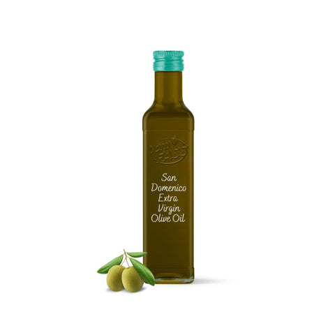 Extra virgin San Domenico olive oil in a glass bottle with a green cap, accompanied by fresh green olives.